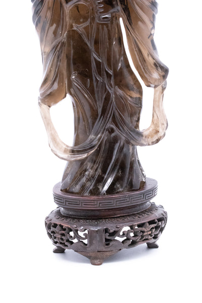 CHINA POST 1912 STANDING QUAN YIN CARVED IN SMOKEY ROCK QUARTZ WITH A BASE