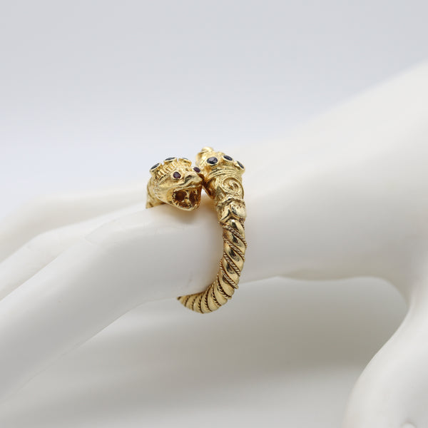 *Lalaounis 1970 Chimeras Lions Heads crossover Ring in 18 kt gold with Sapphires & Rubies