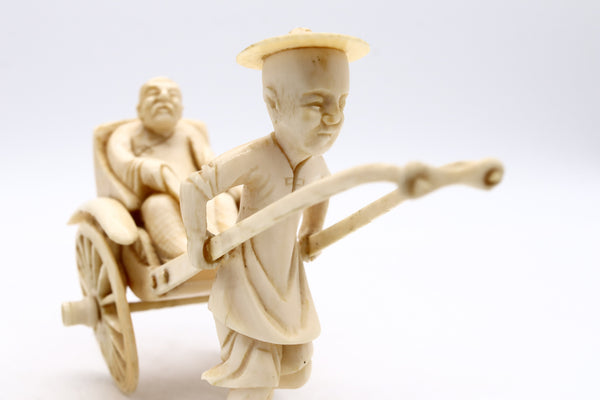 CHINA 1920 CHINESE CARVED MINIATURE OF A DOUBLE WHEELS CARRIAGE WITH RIDERS